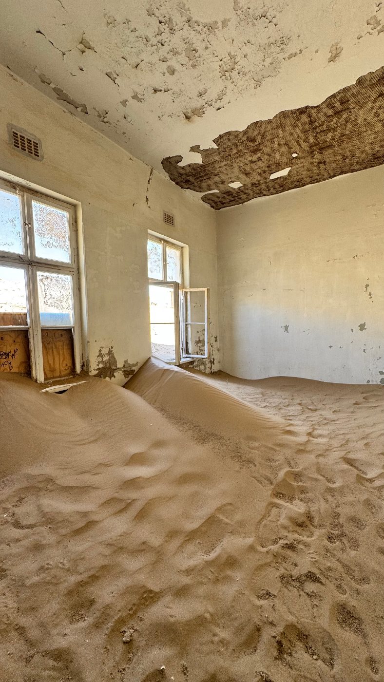 A room at Kolmanskop today, half-filled with sand